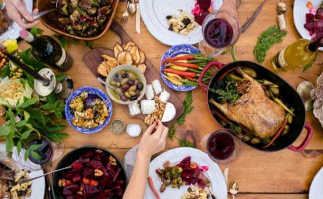 Looking down at a tabled filled with Thanksgiving offerings.