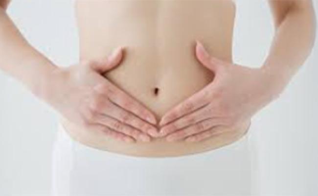A person holding their stomach.