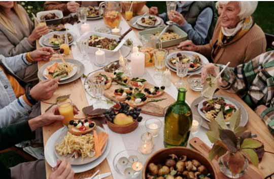 A large group enjoying Thanksgiving Dinner