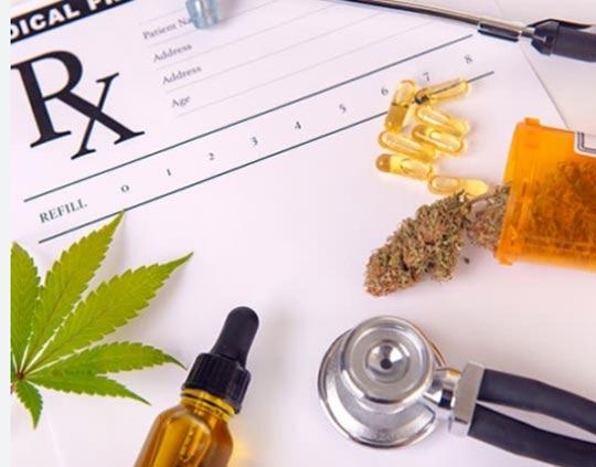 An assortment  of Medical Cannabis displayed with medical accessories