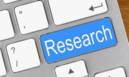 Illustration of a portion of a keyboard with the "Enter" key labeled as "Research"